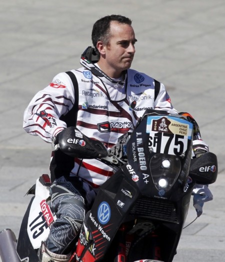 Argentine rider Jorge Boero drives his Beta JMB from the podium during the departure ceremony of the fourth South American edition of the Dakar Rally 2012 in Mar del Plata